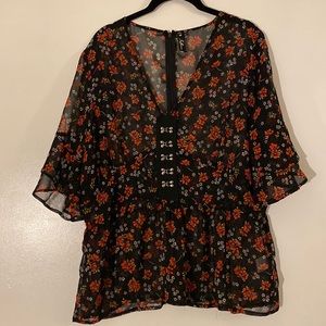 Floral peplum blouse with corset-style design